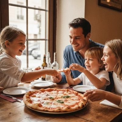 Happy family sharing a delicious pizza at a restaurant table